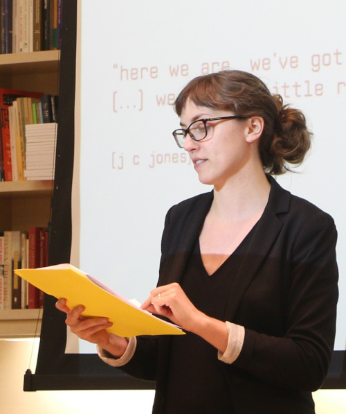 Medium shot color photograph of Brooke Ellsworth reading her work