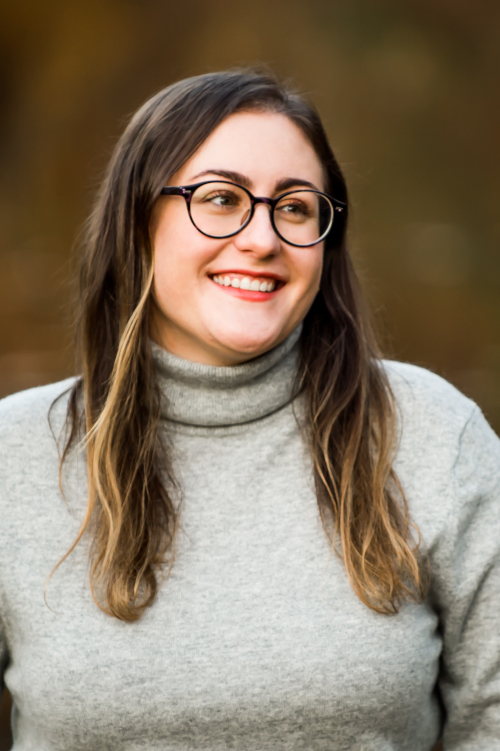 Color headshot of poet Laura Creste