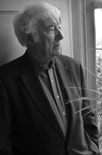 Photograph of Seamus Heaney looking out of a window